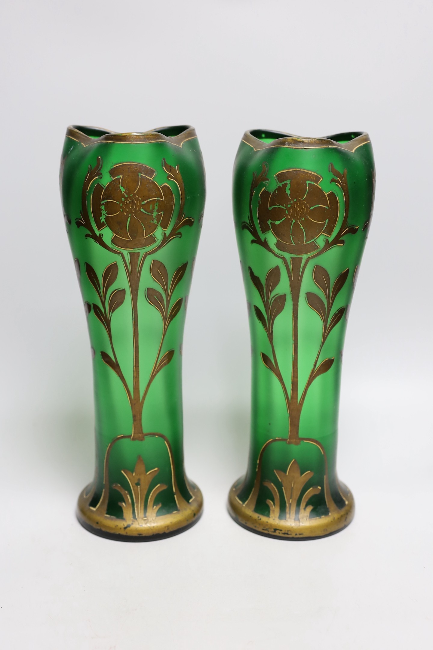 A pair of French green glass and gilt decorated Art Nouveau vases, 34cms high